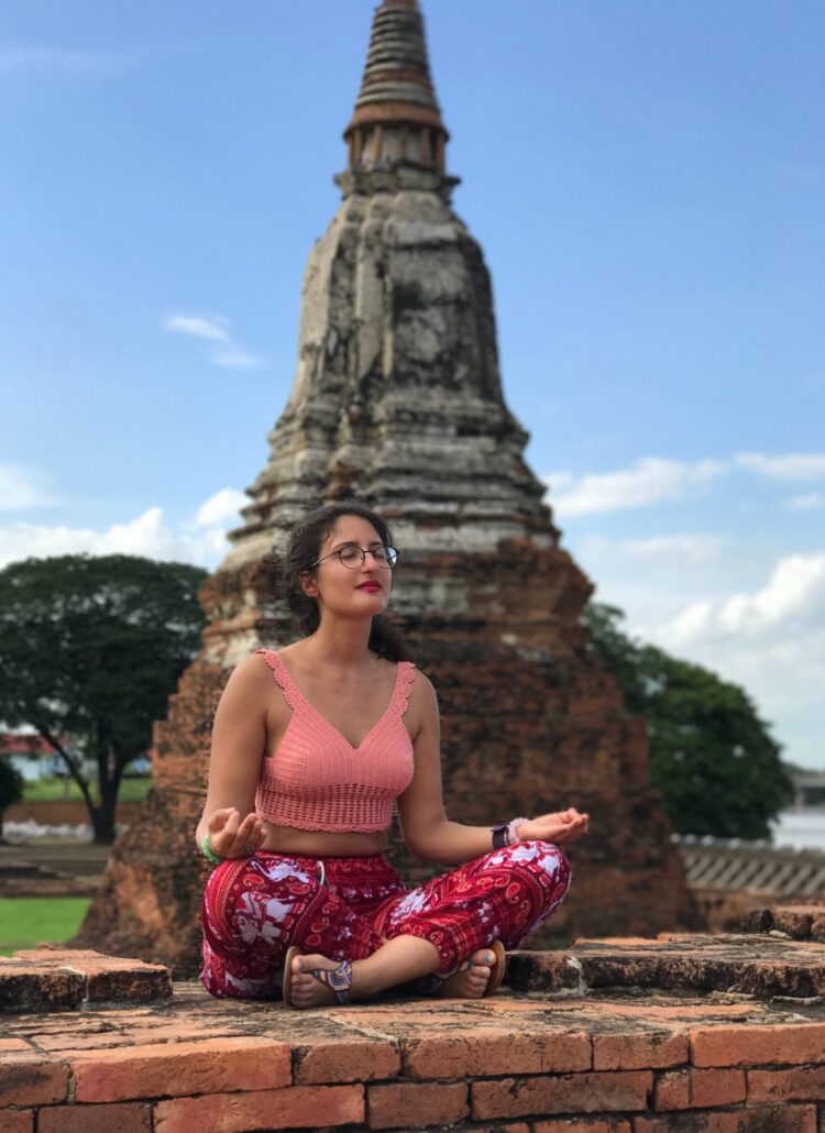 girl meditating in thailand