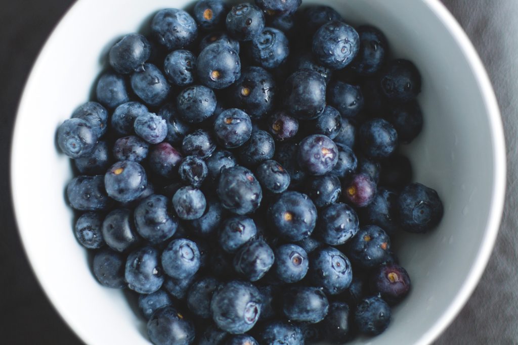 BOWL OF Blueberries, describing in foods that increase metabolism and burn fat
